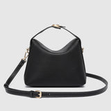 The Louenhide Andie Handbag is this season's go-to event bag. Add an element of playful luxury to your event attire with this sweet and slouchy clutch bag. Designed with a clever minimalistic fold-over closure and two piece clasped handle in a gorgeous trapeze shape, this convertible women's handbag is the perfect way to inject colour into your summer wardrobe. Loop the Andie over your wrist or, for a handsfree moment, attach the adjustable bag strap to wear as a crossbody bag. Showcasing a spacious interio