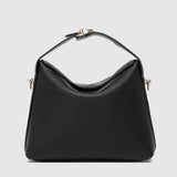 The Louenhide Andie Handbag is this season's go-to event bag. Add an element of playful luxury to your event attire with this sweet and slouchy clutch bag. Designed with a clever minimalistic fold-over closure and two piece clasped handle in a gorgeous trapeze shape, this convertible women's handbag is the perfect way to inject colour into your summer wardrobe. Loop the Andie over your wrist or, for a handsfree moment, attach the adjustable bag strap to wear as a crossbody bag. Showcasing a spacious interio