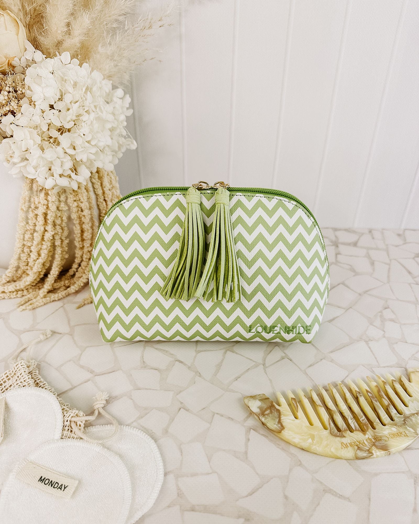 The Louenhide Baby Audrey Chevron Makeup Bag is a small, yet practical cosmetic case to add to your carry-on for your next weekend getaway.