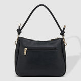 The Louenhide Baby Remi Shoulder Bag is a classic women's everyday bag with elevated style. Designed in a soft and slouchy silhouette with smooth vegan leather, this casual hobo bag is sure to turn heads with its timeless knot detailing strap feature.
