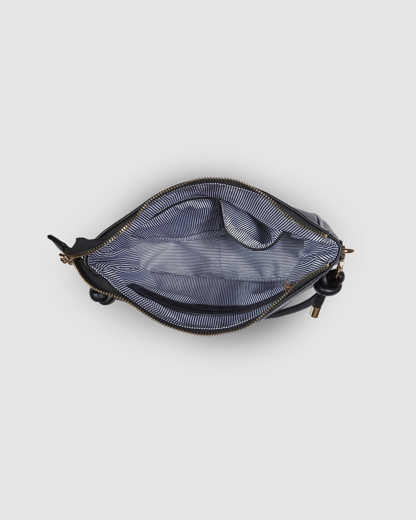 The Louenhide Baby Remi Shoulder Bag is a classic women's everyday bag with elevated style. Designed in a soft and slouchy silhouette with smooth vegan leather, this casual hobo bag is sure to turn heads with its timeless knot detailing strap feature.
