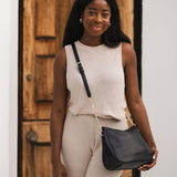 The Louenhide Baby Remi Shoulder Bag is a classic women's everyday bag with elevated style. Designed in a soft and slouchy silhouette with smooth vegan leather, this casual hobo bag is sure to turn heads with its timeless knot detailing strap feature.
