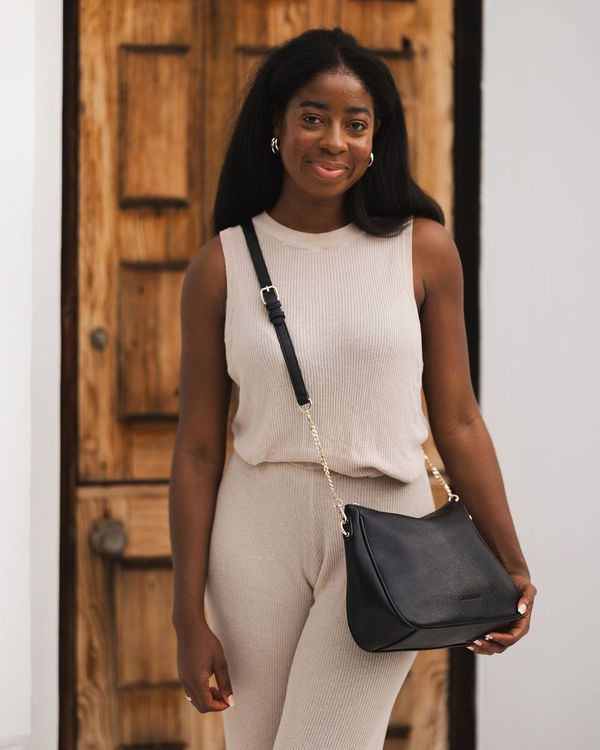 The Louenhide Baby Remi Shoulder Bag is a classic women's everyday bag with elevated style. Designed in a soft and slouchy silhouette with smooth vegan leather, this casual hobo bag is sure to turn heads with its timeless knot detailing strap feature.