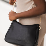 The Louenhide Baby Remi Shoulder Bag is a classic women's everyday bag with elevated style. Designed in a soft and slouchy silhouette with smooth vegan leather, this casual hobo bag is sure to turn heads with its timeless knot detailing strap feature.