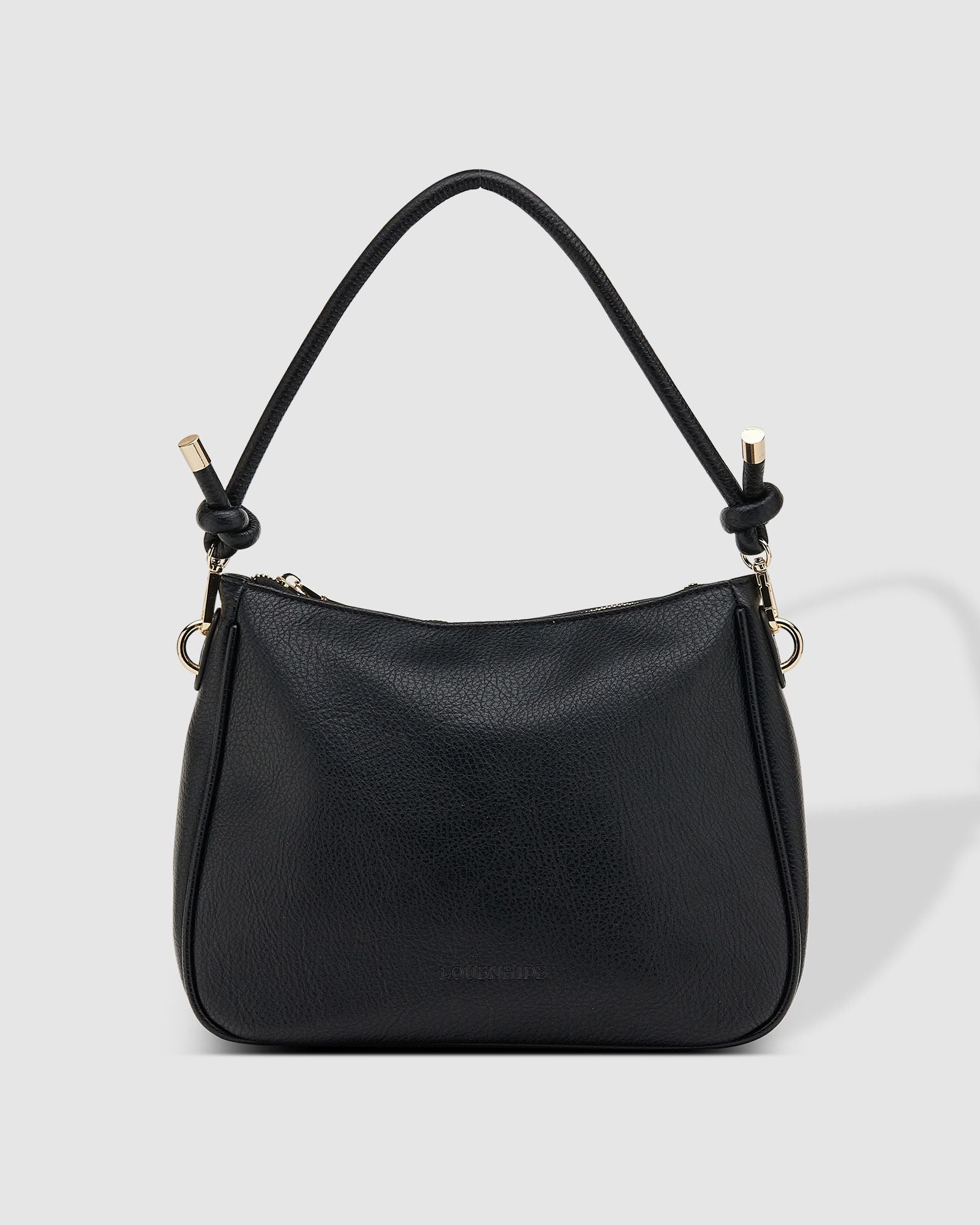 The Louenhide Baby Remi Shoulder Bag is a classic women's everyday bag with elevated style. Designed in a soft and slouchy silhouette with smooth vegan leather, this casual hobo bag is sure to turn heads with its timeless knot detailing strap feature.