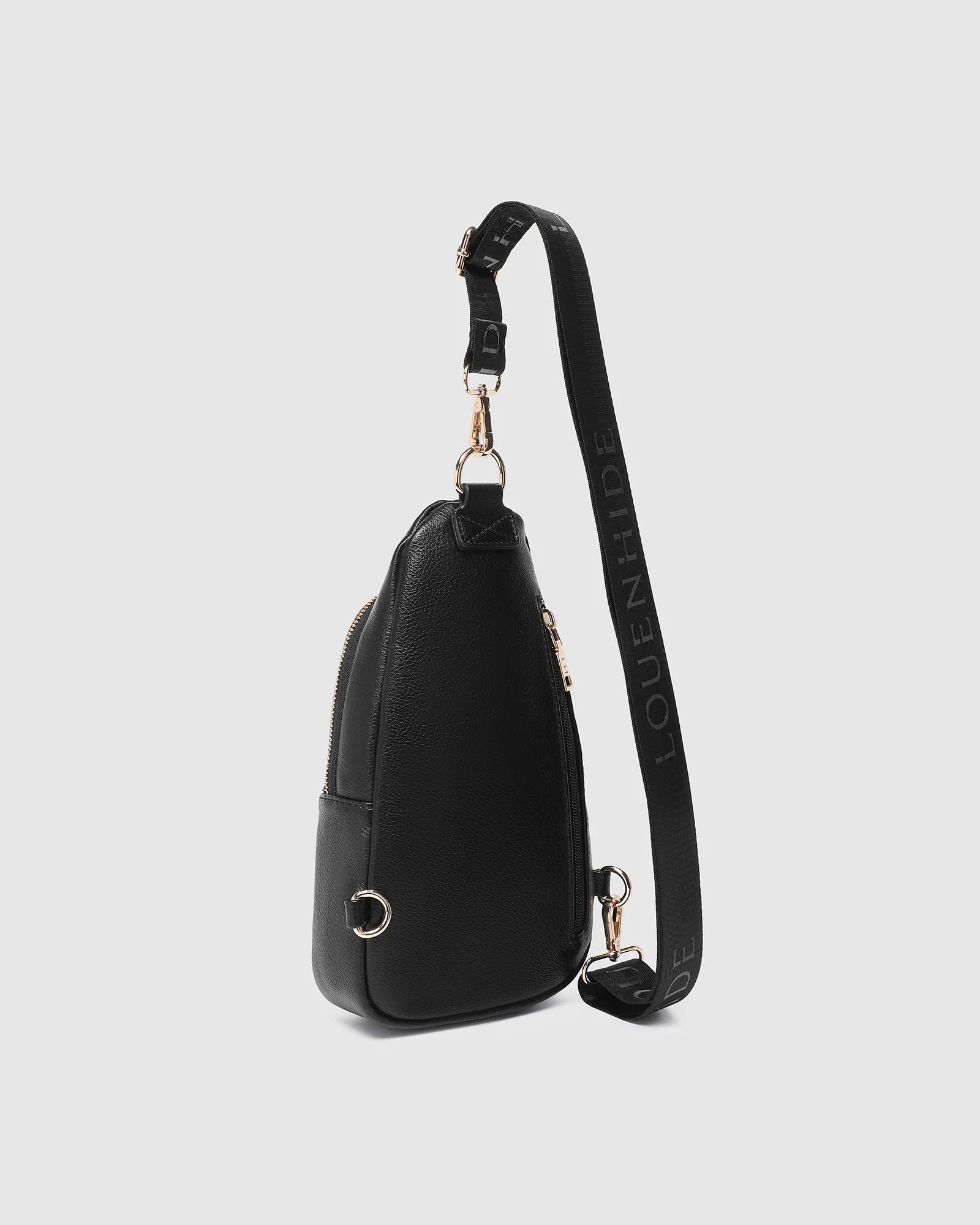 The Louenhide Bella Sling Bag is designed with both style and functionality in mind. Travel organization has never been easier with the dual compartment design ensuring your valuables are within reach and secured safely with the zip closures. Featuring an adjustable and detachable strap allows you to choose the way your bag slings. Whether over your left or right shoulder, this faux leather sling bag ensures comfortable all-day wear. This small sling backpack adds a refined touch to any casual outfit, enhan