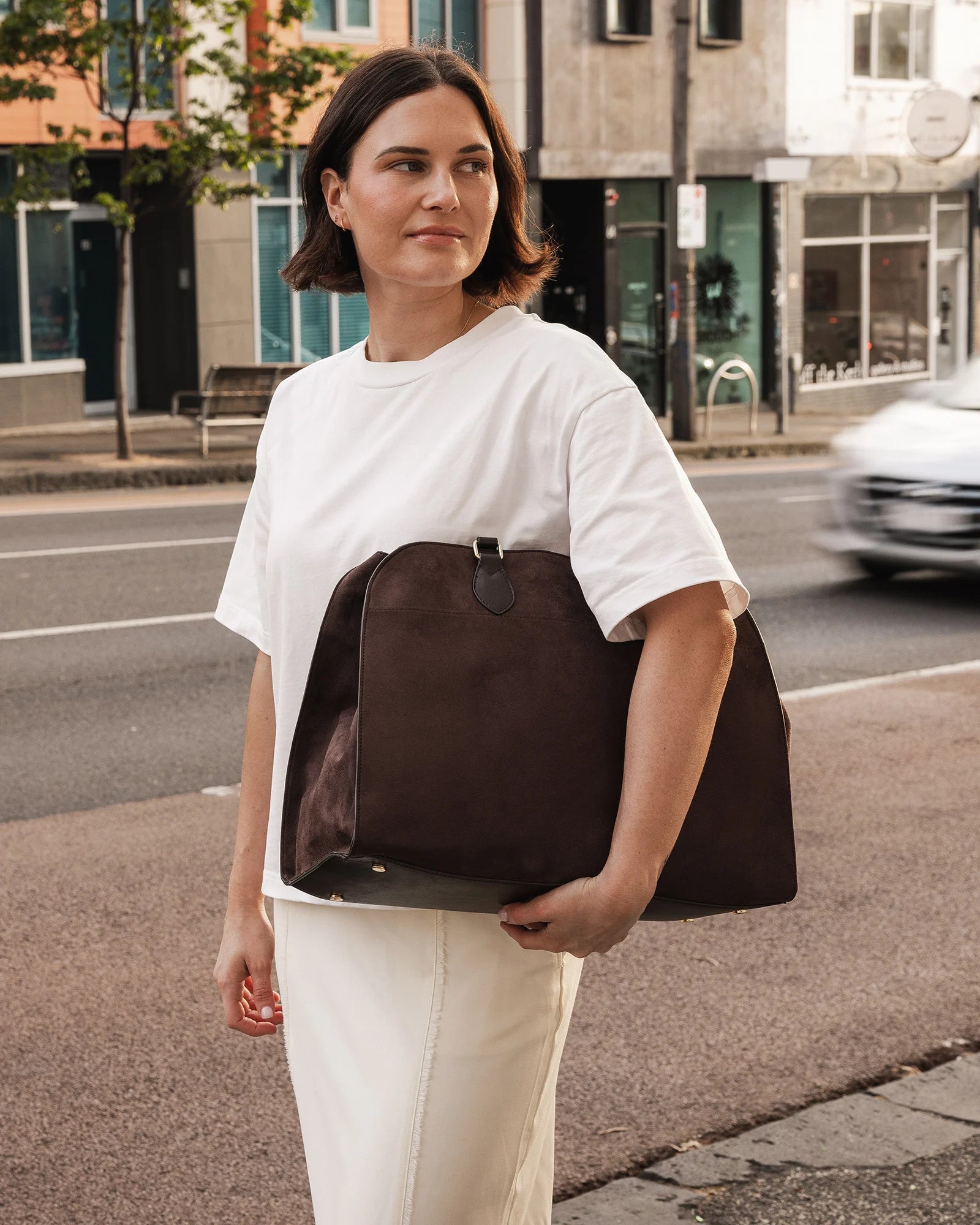 The Louenhide Blaire Tote Bag is the definition of an effortless, statement style. Designed with a bold and unique silhouette, this large tote bag is the perfect throw and go piece with an elevated edge. Designed to have a spacious interior, you can easily fit your daily essentials – and then some. Whether en route to work or heading out for the day, wear it over the shoulder or carry in hand, and let the day unfold. A refined take on an everyday essential, the Blaire Tote Bag blends structure and softness