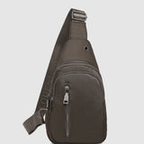 The Louenhide Boyd Nylon Sling Bag is an on-trend unisex sling bag designed with both style and functionality in mind. Organisation has never been easier with the three-section design, your valuables are within easy reach and secured safely with the stylish gunmetal zippers. Whether you're chasing an urban aesthetic or embodying an off-duty street style, this unisex nylon sling bag adapts to any casual outfit, enhancing your personal style while still offering ultimate practicality. The Boyd Khaki features