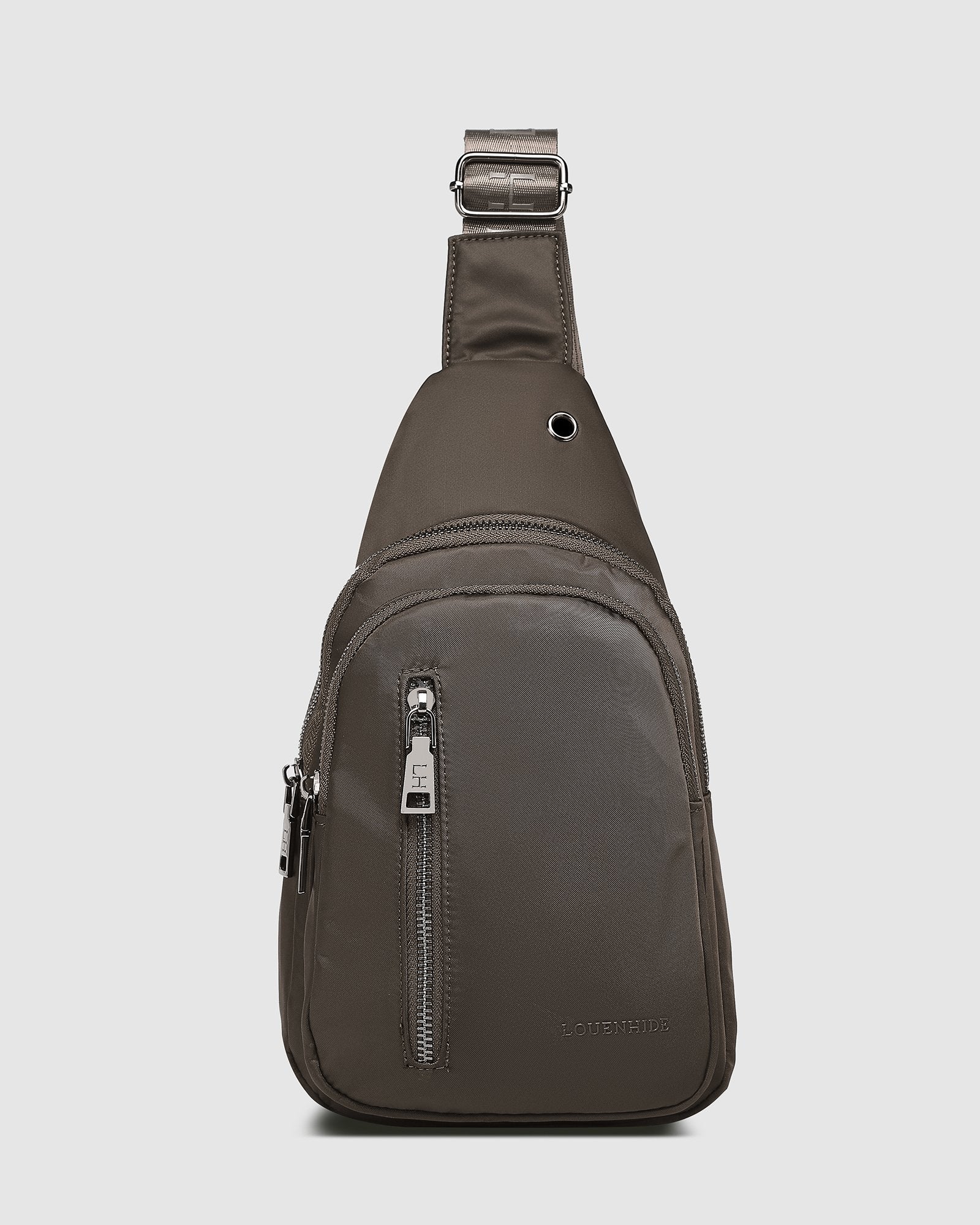 The Louenhide Boyd Nylon Sling Bag is an on-trend unisex sling bag designed with both style and functionality in mind. Organisation has never been easier with the three-section design, your valuables are within easy reach and secured safely with the stylish gunmetal zippers. Whether you're chasing an urban aesthetic or embodying an off-duty street style, this unisex nylon sling bag adapts to any casual outfit, enhancing your personal style while still offering ultimate practicality. The Boyd Khaki features