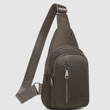 The Louenhide Boyd Nylon Sling Bag is an on-trend unisex sling bag designed with both style and functionality in mind. Organisation has never been easier with the three-section design, your valuables are within easy reach and secured safely with the stylish gunmetal zippers. Whether you're chasing an urban aesthetic or embodying an off-duty street style, this unisex nylon sling bag adapts to any casual outfit, enhancing your personal style while still offering ultimate practicality. The Boyd Khaki features