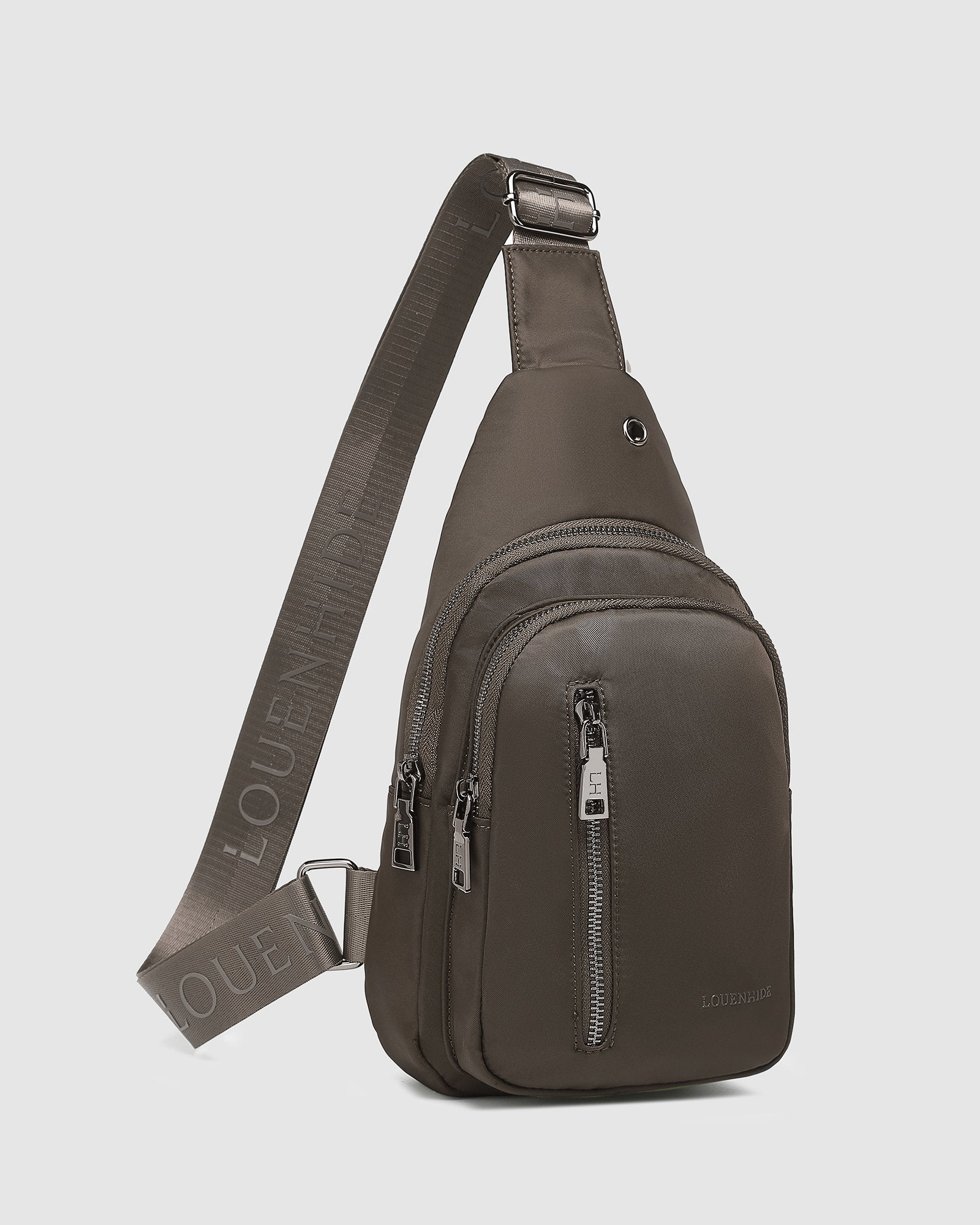 The Louenhide Boyd Nylon Sling Bag is an on-trend unisex sling bag designed with both style and functionality in mind. Organisation has never been easier with the three-section design, your valuables are within easy reach and secured safely with the stylish gunmetal zippers. Whether you're chasing an urban aesthetic or embodying an off-duty street style, this unisex nylon sling bag adapts to any casual outfit, enhancing your personal style while still offering ultimate practicality. The Boyd Khaki features