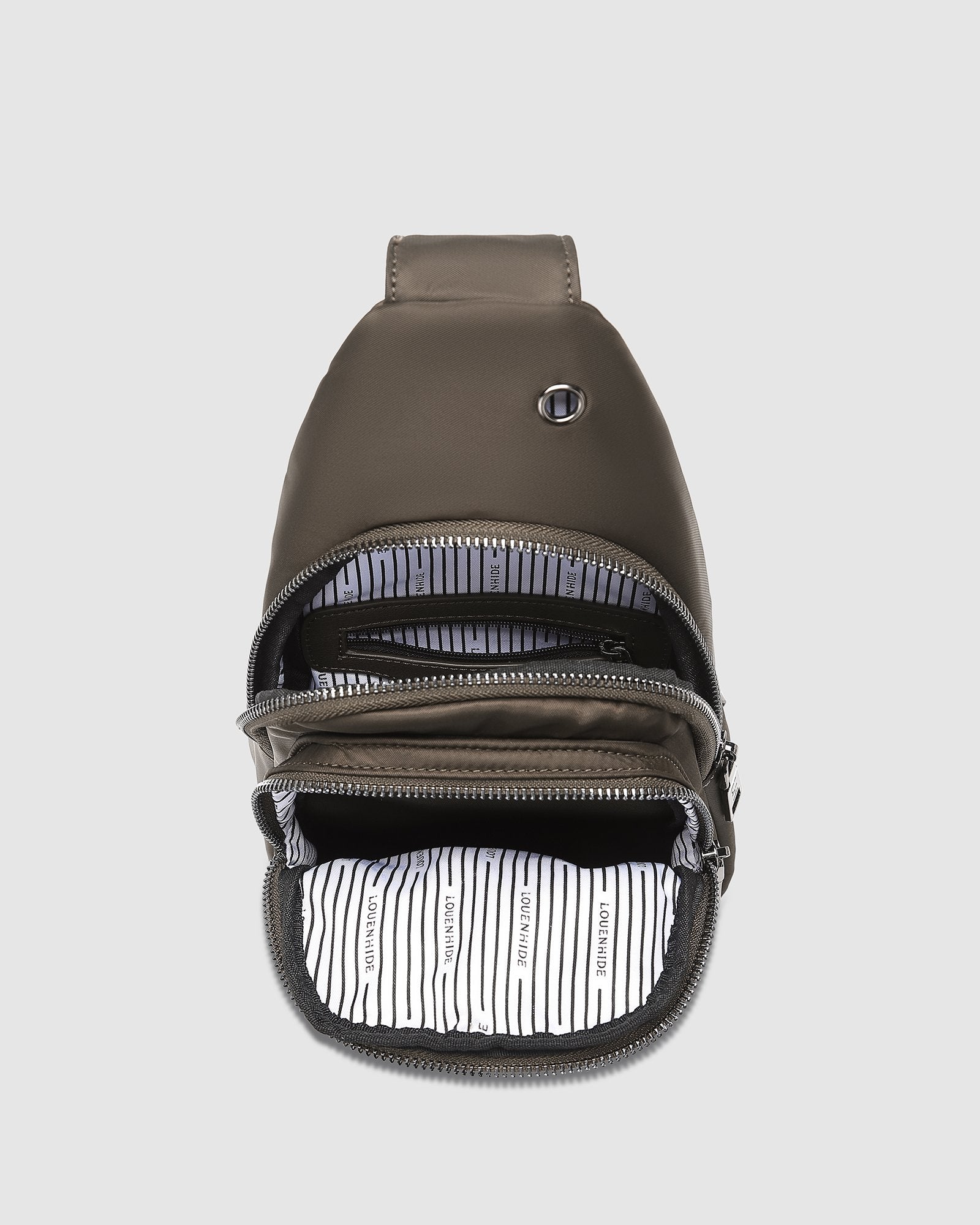The Louenhide Boyd Nylon Sling Bag is an on-trend unisex sling bag designed with both style and functionality in mind. Organisation has never been easier with the three-section design, your valuables are within easy reach and secured safely with the stylish gunmetal zippers. Whether you're chasing an urban aesthetic or embodying an off-duty street style, this unisex nylon sling bag adapts to any casual outfit, enhancing your personal style while still offering ultimate practicality. The Boyd Khaki features