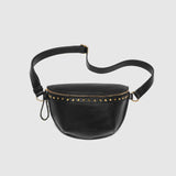 The Louenhide Cassidy Belt Bag is a bold staple designed to add a statement finish to your everyday styling. Crafted in a structured faux leather and adorned with refined hardware accents, this studded bag blends functionality with elevated design. The curved silhouette sits comfortably against the body, while the adjustable strap offers the option to wear it as a classic belt bag or crossbody style - making it one of the best sling bag options for hands-free ease. Compact yet roomy enough for your on-the-g
