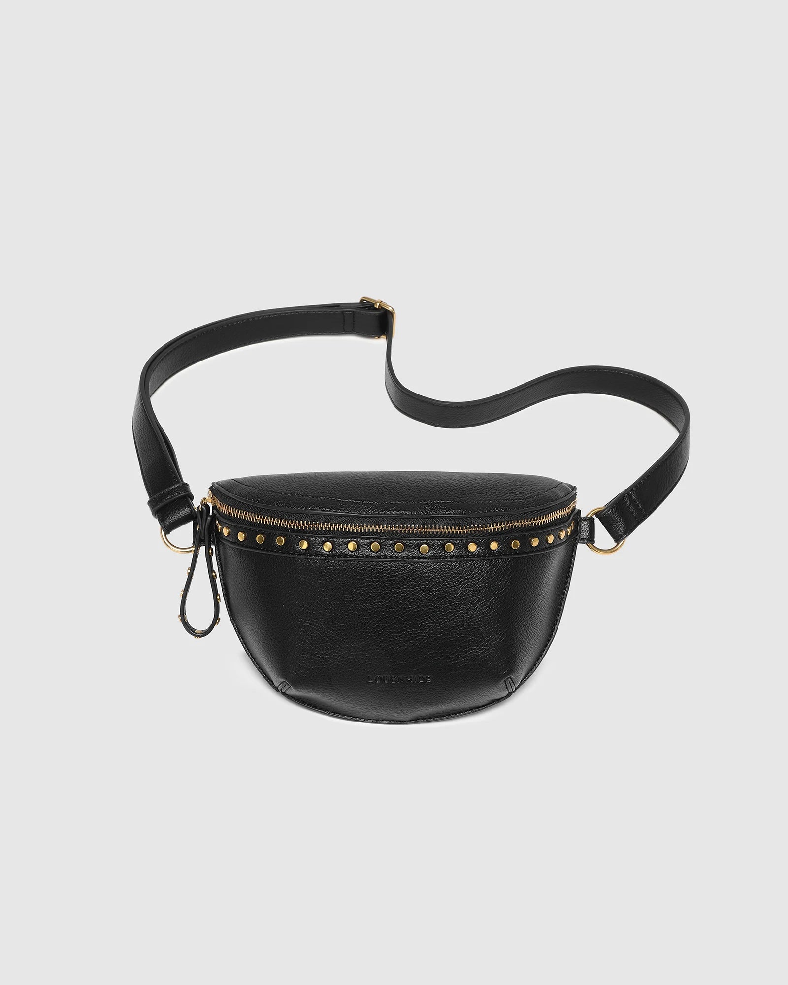 The Louenhide Cassidy Belt Bag is a bold staple designed to add a statement finish to your everyday styling. Crafted in a structured faux leather and adorned with refined hardware accents, this studded bag blends functionality with elevated design. The curved silhouette sits comfortably against the body, while the adjustable strap offers the option to wear it as a classic belt bag or crossbody style - making it one of the best sling bag options for hands-free ease. Compact yet roomy enough for your on-the-g