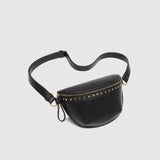 The Louenhide Cassidy Belt Bag is a bold staple designed to add a statement finish to your everyday styling. Crafted in a structured faux leather and adorned with refined hardware accents, this studded bag blends functionality with elevated design. The curved silhouette sits comfortably against the body, while the adjustable strap offers the option to wear it as a classic belt bag or crossbody style - making it one of the best sling bag options for hands-free ease. Compact yet roomy enough for your on-the-g