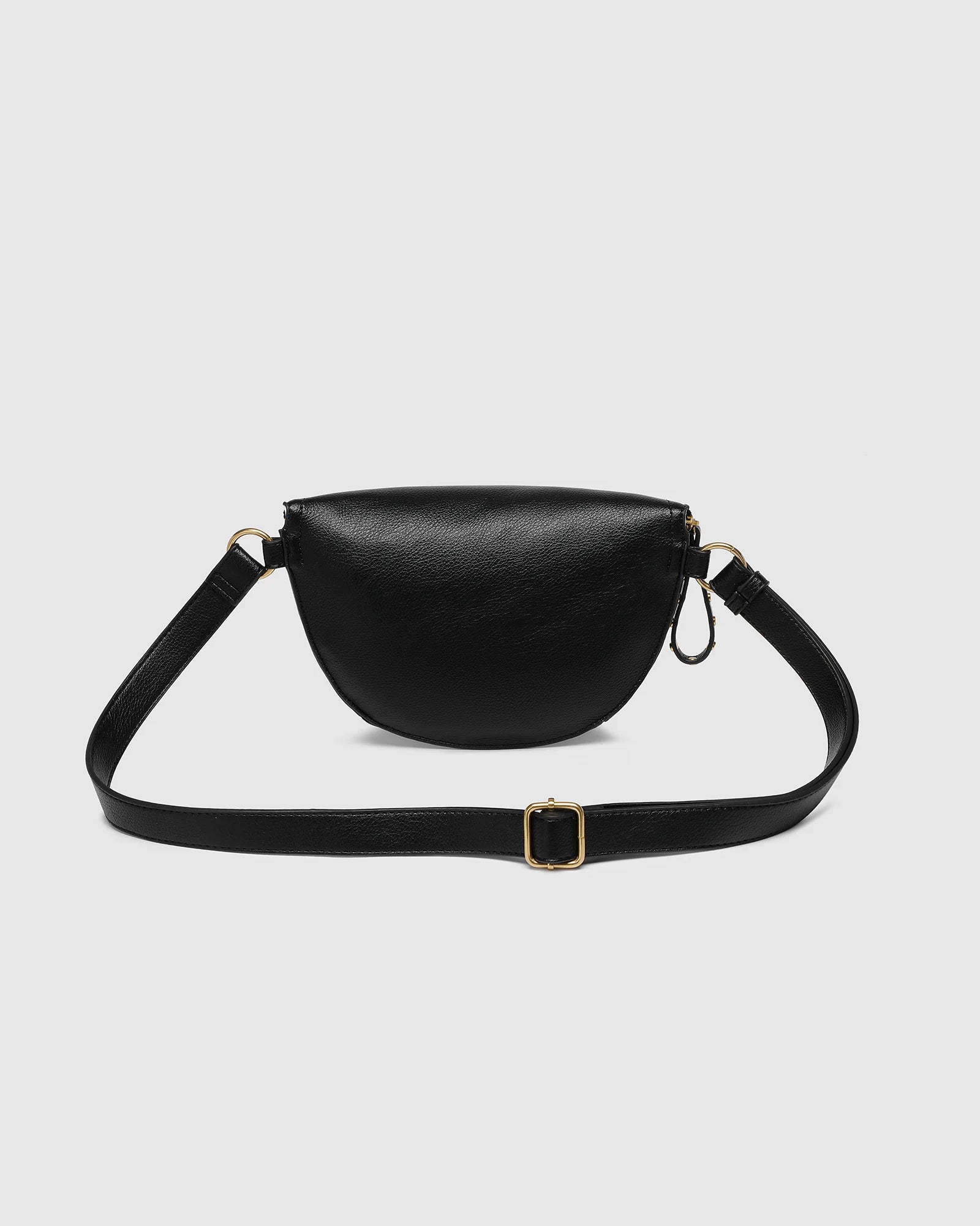 The Louenhide Cassidy Belt Bag is a bold staple designed to add a statement finish to your everyday styling. Crafted in a structured faux leather and adorned with refined hardware accents, this studded bag blends functionality with elevated design. The curved silhouette sits comfortably against the body, while the adjustable strap offers the option to wear it as a classic belt bag or crossbody style - making it one of the best sling bag options for hands-free ease. Compact yet roomy enough for your on-the-g