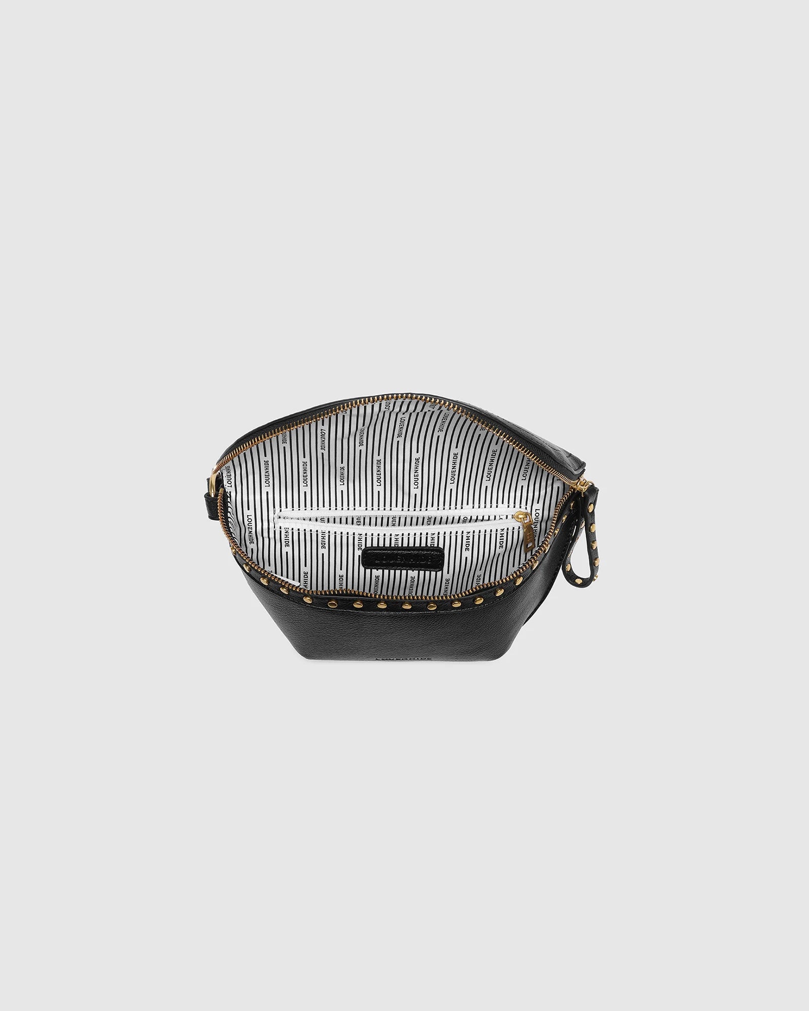 The Louenhide Cassidy Belt Bag is a bold staple designed to add a statement finish to your everyday styling. Crafted in a structured faux leather and adorned with refined hardware accents, this studded bag blends functionality with elevated design. The curved silhouette sits comfortably against the body, while the adjustable strap offers the option to wear it as a classic belt bag or crossbody style - making it one of the best sling bag options for hands-free ease. Compact yet roomy enough for your on-the-g