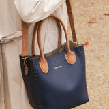The Louenhide Dublin Tote Bag is designed to elevate your style and organize your daily essentials, making it the perfect accessory for everyday errands. Tucked inside, the additional clutch offers a convenient way to keep your valuables secure or choose to carry it as a separate crossbody bag for quick trips out. Wear this tote as a traditional handbag on your shoulder or effortlessly transform it into a crossbody bag with the adjustable vegan leather strap. For comfort and ease wherever you go,