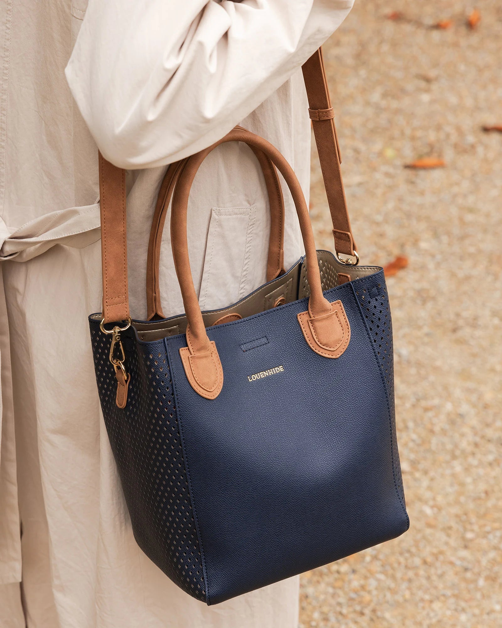 The Louenhide Dublin Tote Bag is designed to elevate your style and organize your daily essentials, making it the perfect accessory for everyday errands. Tucked inside, the additional clutch offers a convenient way to keep your valuables secure or choose to carry it as a separate crossbody bag for quick trips out. Wear this tote as a traditional handbag on your shoulder or effortlessly transform it into a crossbody bag with the adjustable vegan leather strap. For comfort and ease wherever you go,