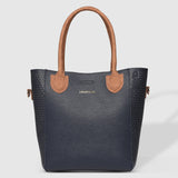 The Louenhide Dublin Tote Bag is designed to elevate your style and organize your daily essentials, making it the perfect accessory for everyday errands. Tucked inside, the additional clutch offers a convenient way to keep your valuables secure or choose to carry it as a separate crossbody bag for quick trips out. Wear this tote as a traditional handbag on your shoulder or effortlessly transform it into a crossbody bag with the adjustable vegan leather strap. For comfort and ease wherever you go,