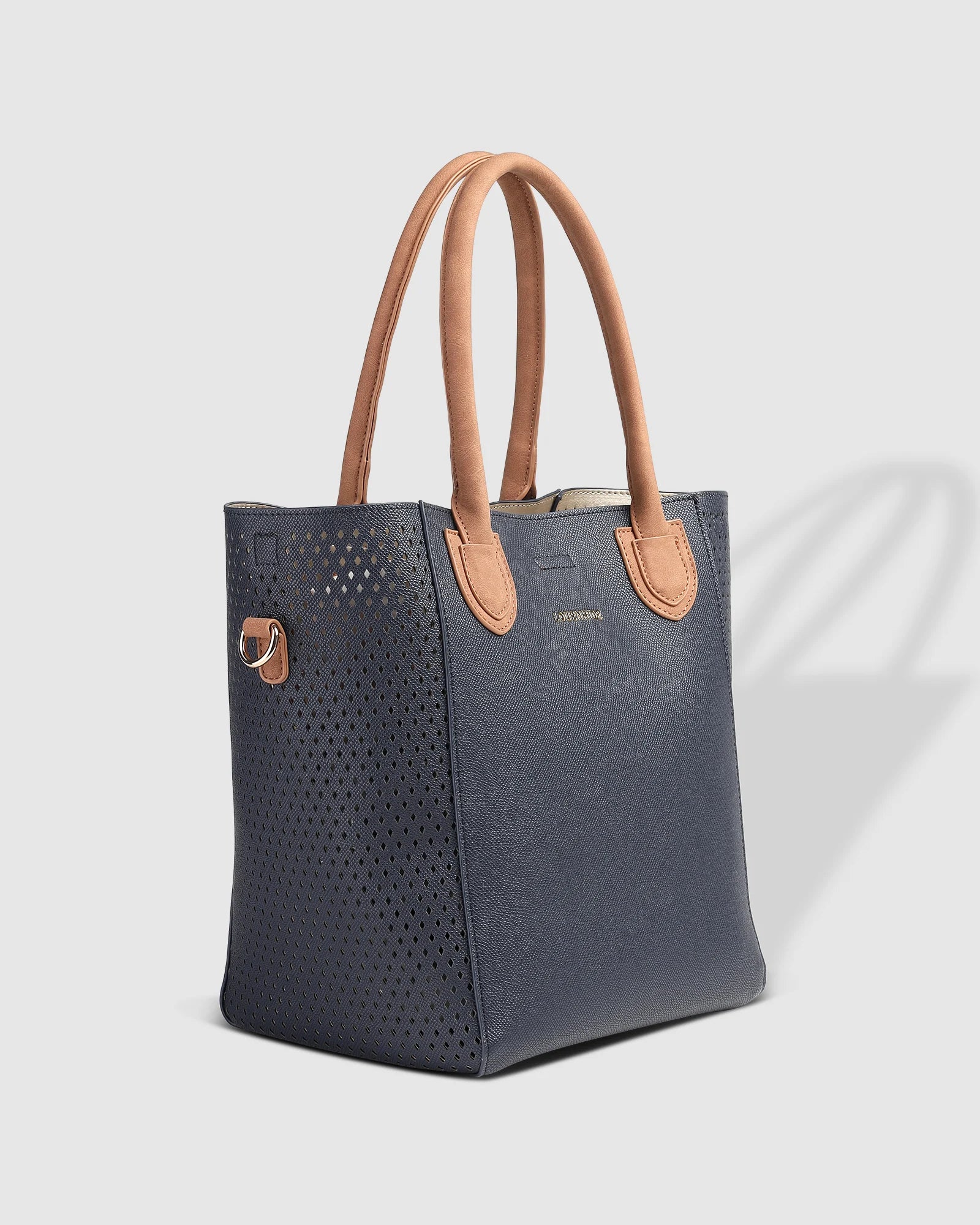 The Louenhide Dublin Tote Bag is designed to elevate your style and organize your daily essentials, making it the perfect accessory for everyday errands. Tucked inside, the additional clutch offers a convenient way to keep your valuables secure or choose to carry it as a separate crossbody bag for quick trips out. Wear this tote as a traditional handbag on your shoulder or effortlessly transform it into a crossbody bag with the adjustable vegan leather strap. For comfort and ease wherever you go,