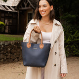 The Louenhide Dublin Tote Bag is designed to elevate your style and organize your daily essentials, making it the perfect accessory for everyday errands. Tucked inside, the additional clutch offers a convenient way to keep your valuables secure or choose to carry it as a separate crossbody bag for quick trips out. Wear this tote as a traditional handbag on your shoulder or effortlessly transform it into a crossbody bag with the adjustable vegan leather strap. For comfort and ease wherever you go,