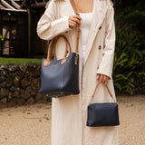 The Louenhide Dublin Tote Bag is designed to elevate your style and organize your daily essentials, making it the perfect accessory for everyday errands. Tucked inside, the additional clutch offers a convenient way to keep your valuables secure or choose to carry it as a separate crossbody bag for quick trips out. Wear this tote as a traditional handbag on your shoulder or effortlessly transform it into a crossbody bag with the adjustable vegan leather strap. For comfort and ease wherever you go,