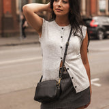 The Louenhide Elle Crossbody Bag is the elevated staple your wardrobe has been waiting for. Designed with a compact rectangular silhouette, this triple compartment crossbody bag keeps your essentials streamlined and organized without compromising style. To switch up your look with ease, opt for the gold chain strap to elevate your dressier on-the-go moments or swap to the matching faux leather strap for an casual feel. Adorned with light gold hardware, this multi-zipper crossbody bag is designed to carry