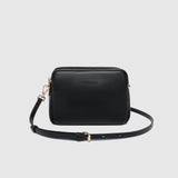 The Louenhide Elle Crossbody Bag is the elevated staple your wardrobe has been waiting for. Designed with a compact rectangular silhouette, this triple compartment crossbody bag keeps your essentials streamlined and organized without compromising style. To switch up your look with ease, opt for the gold chain strap to elevate your dressier on-the-go moments or swap to the matching faux leather strap for an casual feel. Adorned with light gold hardware, this multi-zipper crossbody bag is designed to carry