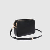 The Louenhide Elle Crossbody Bag is the elevated staple your wardrobe has been waiting for. Designed with a compact rectangular silhouette, this triple compartment crossbody bag keeps your essentials streamlined and organized without compromising style. To switch up your look with ease, opt for the gold chain strap to elevate your dressier on-the-go moments or swap to the matching faux leather strap for an casual feel. Adorned with light gold hardware, this multi-zipper crossbody bag is designed to carry
