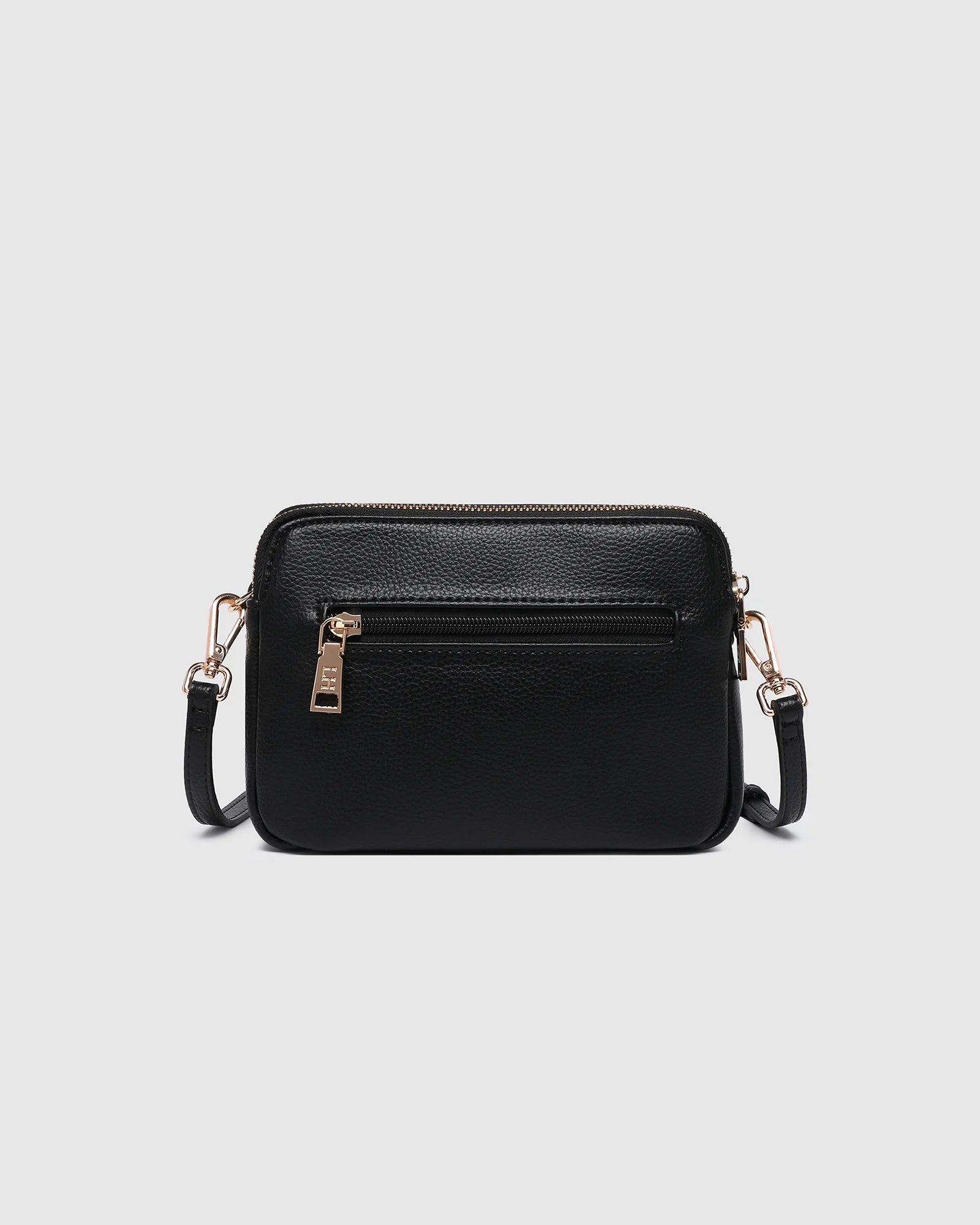 The Louenhide Elle Crossbody Bag is the elevated staple your wardrobe has been waiting for. Designed with a compact rectangular silhouette, this triple compartment crossbody bag keeps your essentials streamlined and organized without compromising style. To switch up your look with ease, opt for the gold chain strap to elevate your dressier on-the-go moments or swap to the matching faux leather strap for an casual feel. Adorned with light gold hardware, this multi-zipper crossbody bag is designed to carry