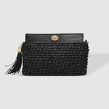 The Louenhide Fern Raffia Crossbody is the ultimate accessory for your summer getaway. Doubling as a crossbody or clutch, it embodies the essence of sun-soaked adventures and chic style.