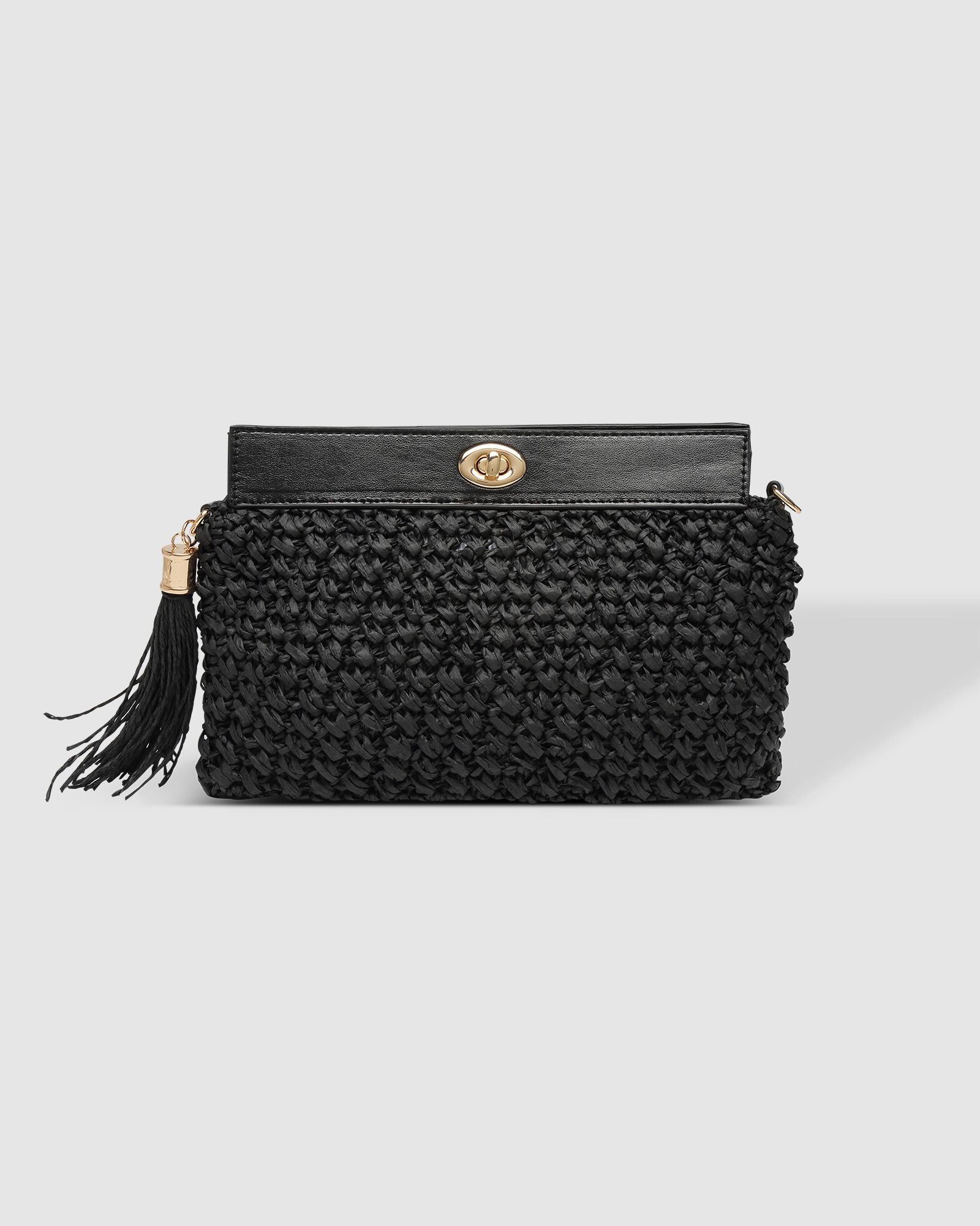 The Louenhide Fern Raffia Crossbody is the ultimate accessory for your summer getaway. Doubling as a crossbody or clutch, it embodies the essence of sun-soaked adventures and chic style.