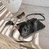 The Louenhide Fern Raffia Crossbody is the ultimate accessory for your summer getaway. Doubling as a crossbody or clutch, it embodies the essence of sun-soaked adventures and chic style.