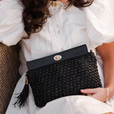 The Louenhide Fern Raffia Crossbody is the ultimate accessory for your summer getaway. Doubling as a crossbody or clutch, it embodies the essence of sun-soaked adventures and chic style.