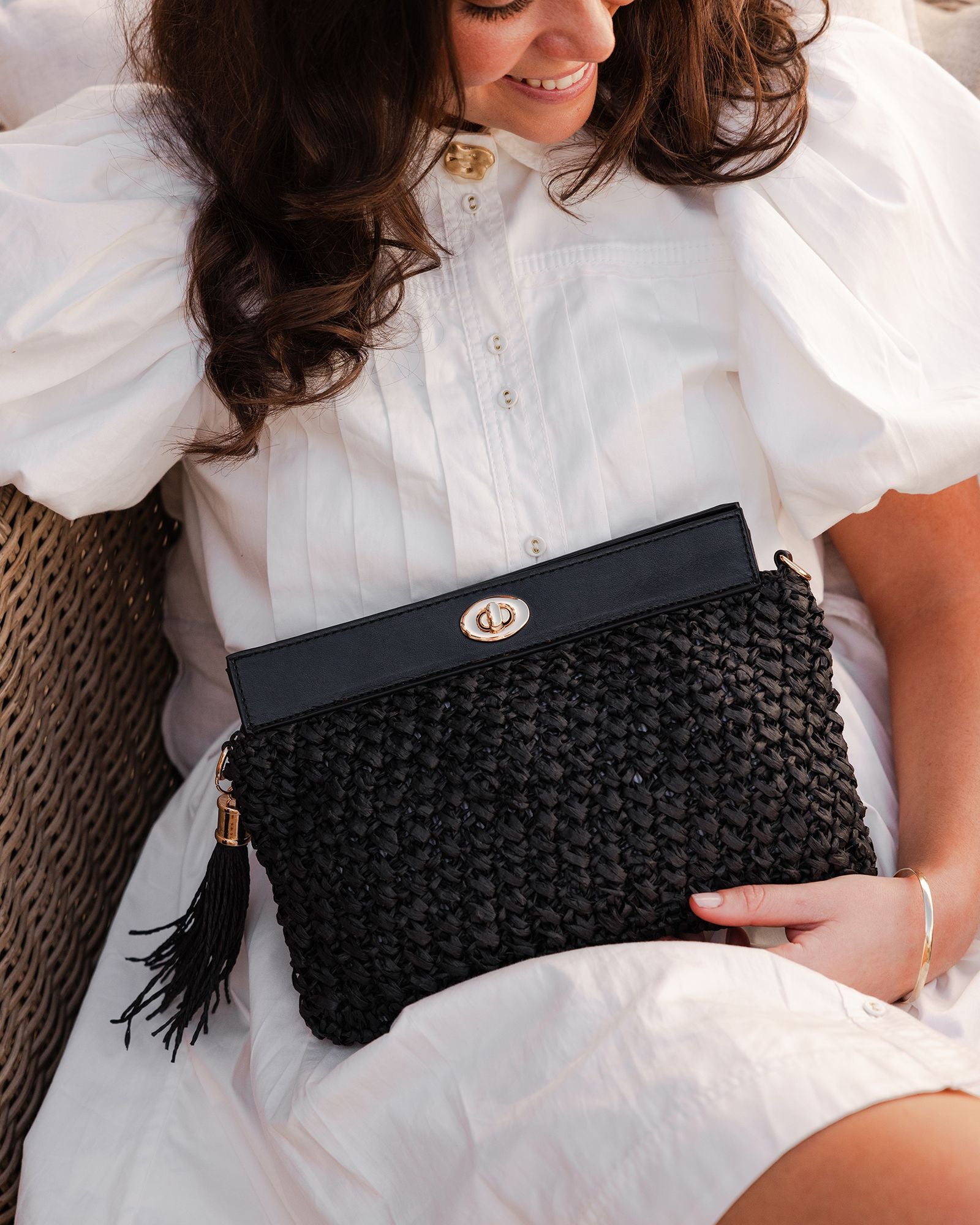 The Louenhide Fern Raffia Crossbody is the ultimate accessory for your summer getaway. Doubling as a crossbody or clutch, it embodies the essence of sun-soaked adventures and chic style.
