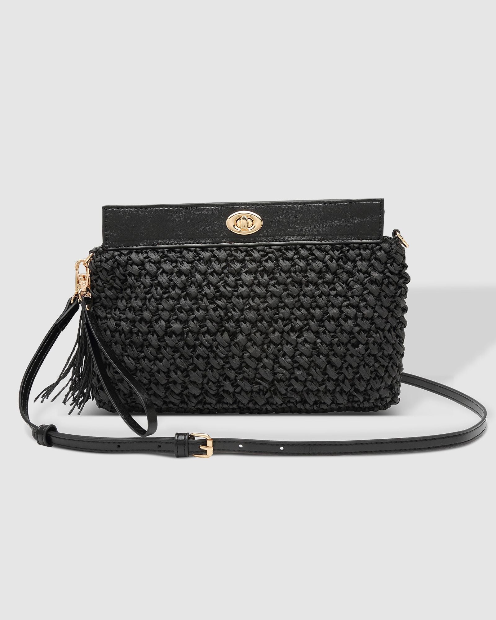 The Louenhide Fern Raffia Crossbody is the ultimate accessory for your summer getaway. Doubling as a crossbody or clutch, it embodies the essence of sun-soaked adventures and chic style.