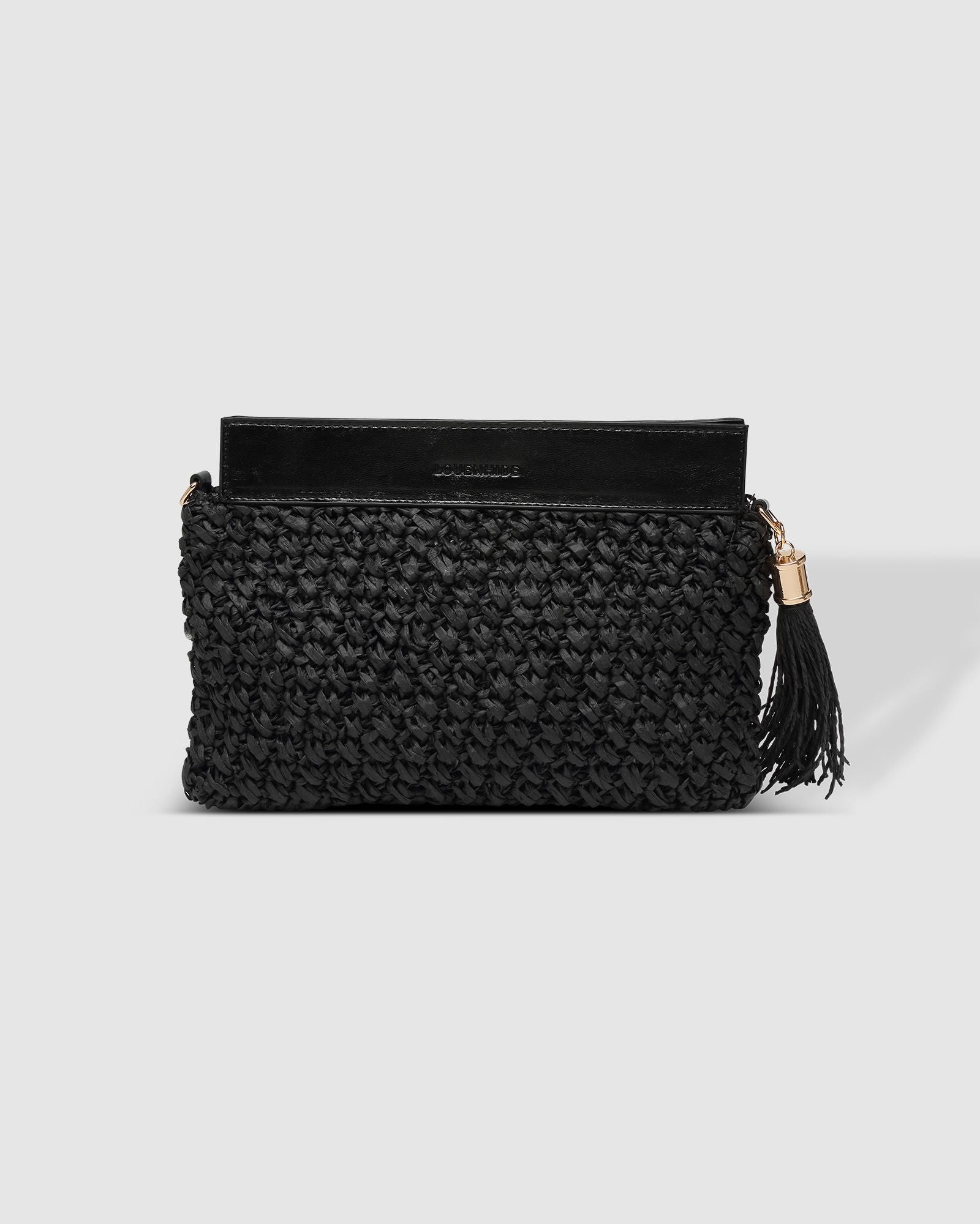 The Louenhide Fern Raffia Crossbody is the ultimate accessory for your summer getaway. Doubling as a crossbody or clutch, it embodies the essence of sun-soaked adventures and chic style.