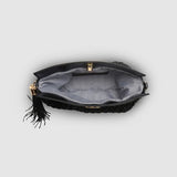 The Louenhide Fern Raffia Crossbody is the ultimate accessory for your summer getaway. Doubling as a crossbody or clutch, it embodies the essence of sun-soaked adventures and chic style.