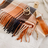 The Louenhide Glasgow Scarf is a timeless tartan pattern in gorgeous winter colourways.