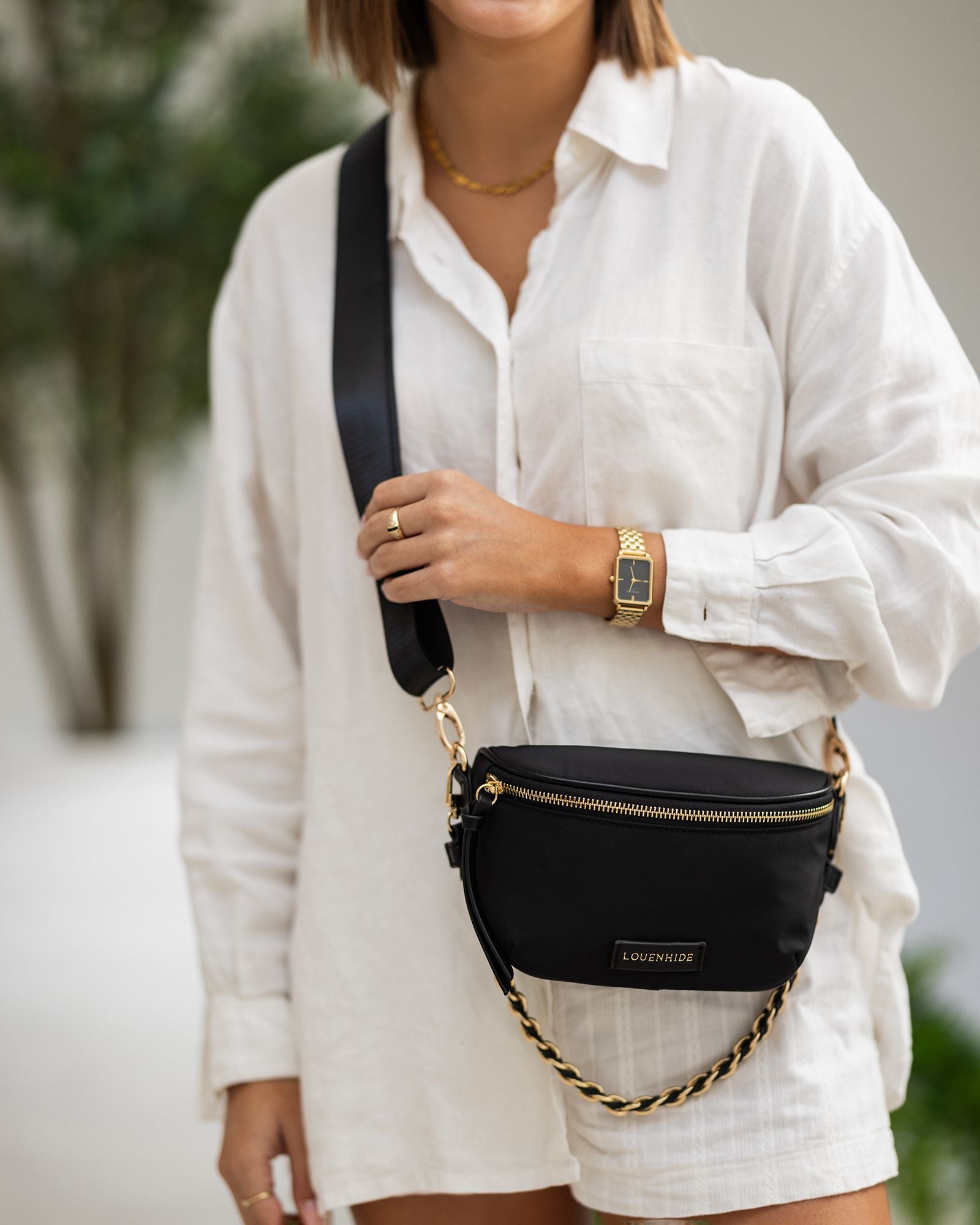 The Louenhide Halsey Nylon Crossbody Bag is the perfect combination of functionality and style. With its adjustable and detachable sateen guitar strap and PU woven shoulder strap, this bag can be worn comfortably as a crossbody or over the shoulder.