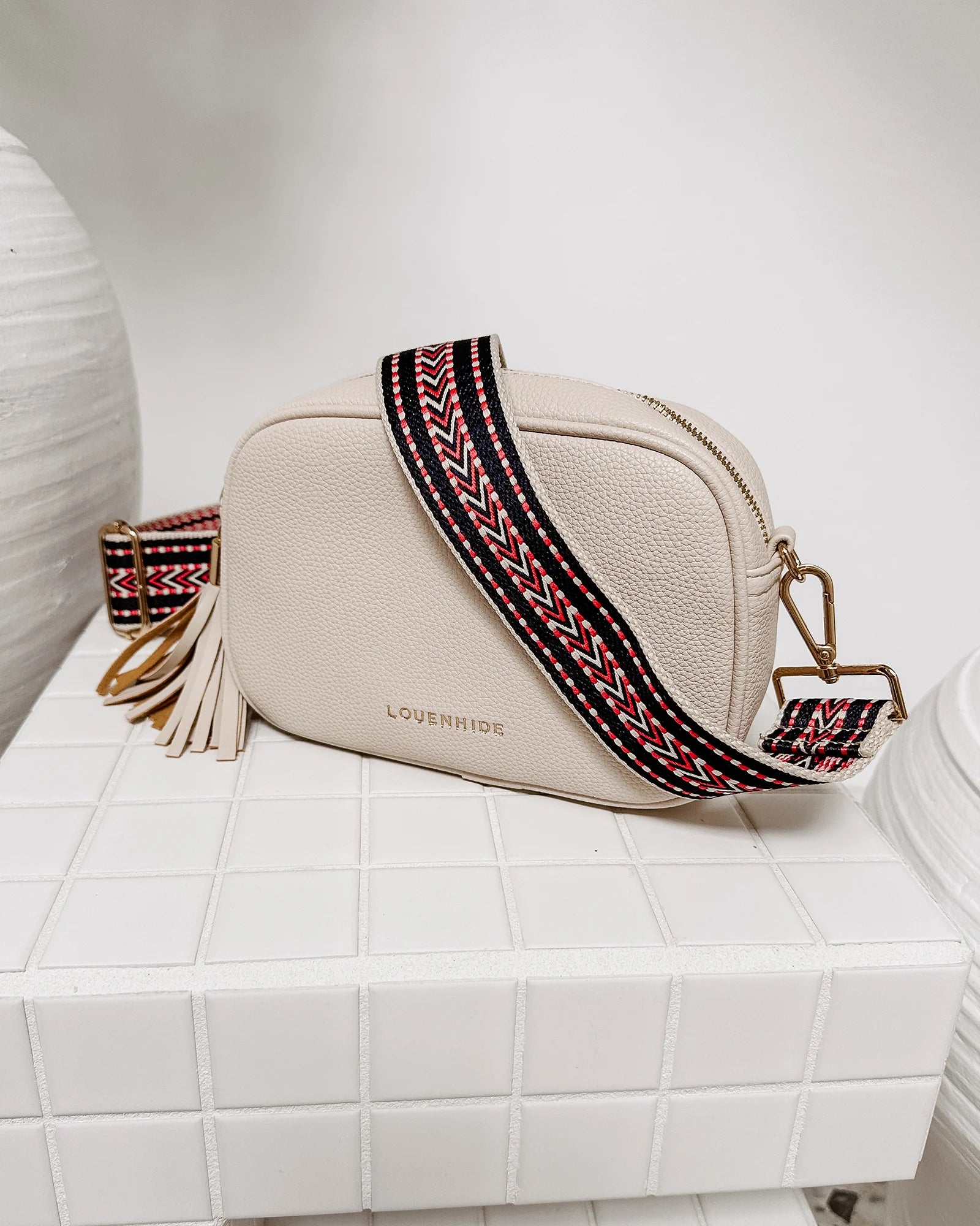 The Louenhide Jacinta Crossbody Bag is the ultimate cool-girl bag, featuring a complimentary detachable guitar strap.