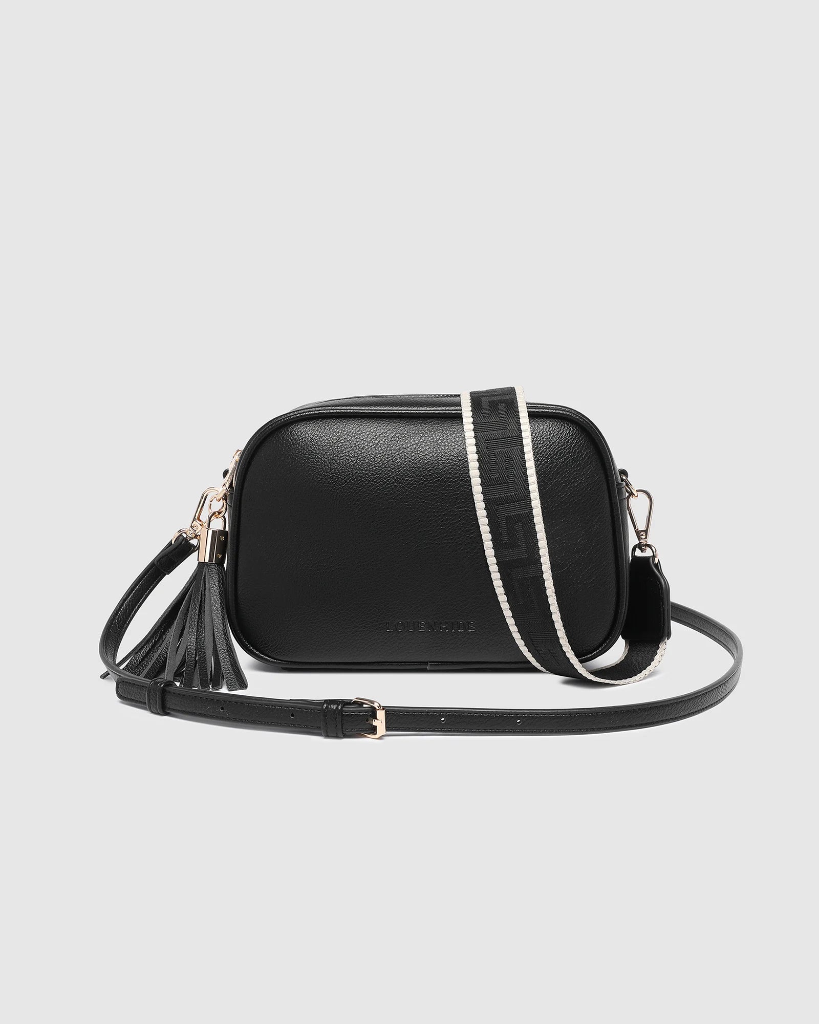 The Louenhide Jacinta Crossbody Bag with Gia Strap is the ultimate everyday bag for women looking for style without compromising function. Now in new season pastel colours and paired with a stylish matching guitar strap, feel luxe and sporty with this soft, camera style bag over your shoulder. Walk out in style with this casual crossbody bag and keep your essentials secure with its slip and zip pockets. The Jacinta is a staple in the Louenhide world, loved by women of all ages and style.