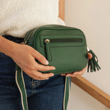 The Louenhide Jacinta Crossbody Bag with Gia Strap is the ultimate everyday bag for women looking for style without compromising function. Now in new season pastel colours and paired with a stylish matching guitar strap, feel luxe and sporty with this soft, camera style bag over your shoulder. Walk out in style with this casual crossbody bag and keep your essentials secure with its slip and zip pockets. The Jacinta is a staple in the Louenhide world, loved by women of all ages and style.