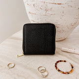 The Louenhide Juniper Jewelry Case is ideal for those who appreciate the finer details in their jewelry storage. Designed with your dynamic lifestyle in mind, this jewellery wallet is compact and portable. Whether placed on your vanity at home or tucked into your luggage for travel, the Juniper ensures your favourite pieces are protected wherever you go. Organize your pieces with the two press stud hooks, slip pocket, drawstring bag, ring roll and earring press stud band. Structured and protected, th