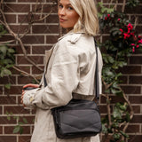 The Louenhide London Crossbody Bag strikes the perfect balance between simplicity and style. While the classic, compact, camera-bag shape is perfect for storing more than the everyday essentials, the multi-compartment design keeps everything you need within reach. From your phone, wallet and keys to your digital camera, a small water bottle and more - when life is on-the-go, take a bag that’s built for movement. Featuring an adjustable webbing strap to ensure comfort, this women’s crossbody bag is the idea