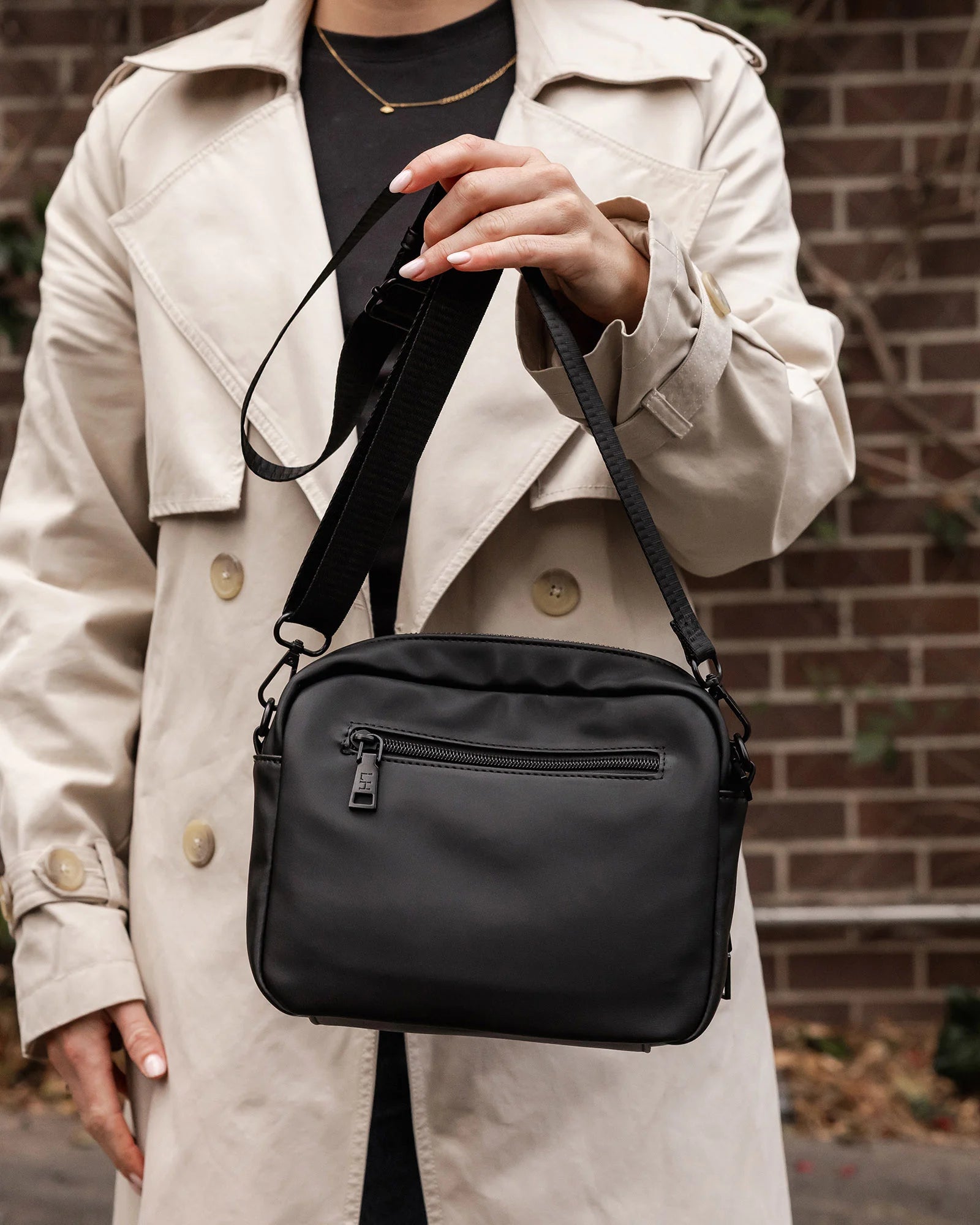 The Louenhide London Crossbody Bag strikes the perfect balance between simplicity and style. While the classic, compact, camera-bag shape is perfect for storing more than the everyday essentials, the multi-compartment design keeps everything you need within reach. From your phone, wallet and keys to your digital camera, a small water bottle and more - when life is on-the-go, take a bag that’s built for movement. Featuring an adjustable webbing strap to ensure comfort, this women’s crossbody bag is the idea