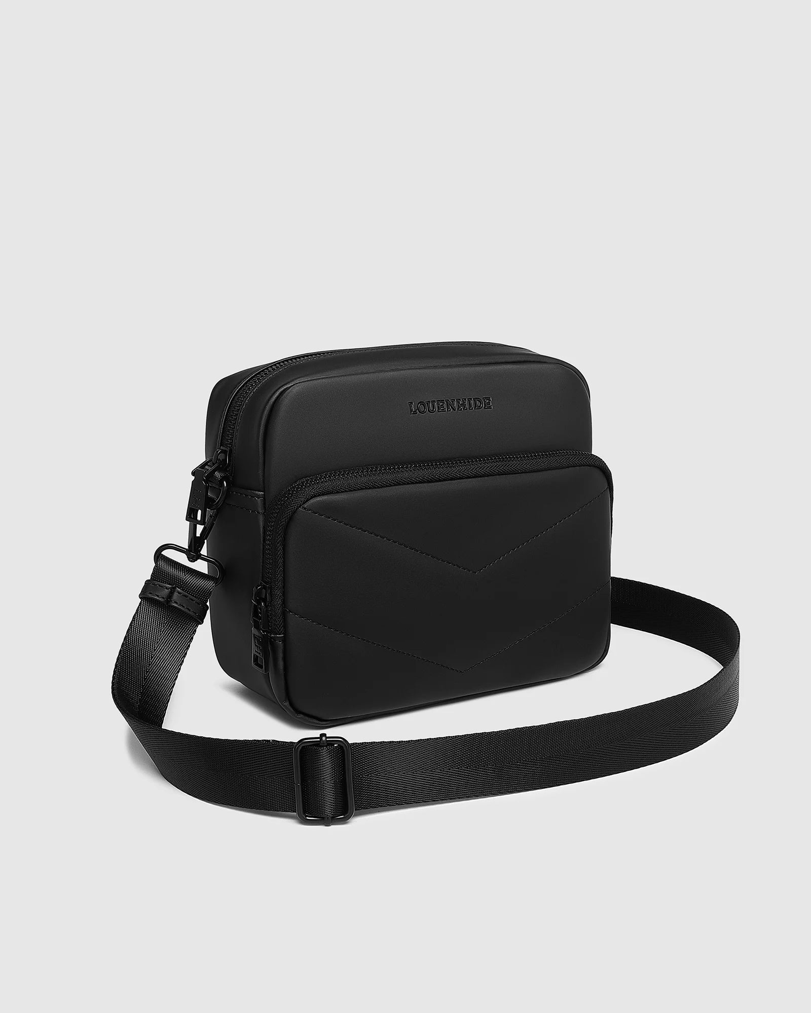 The Louenhide London Crossbody Bag strikes the perfect balance between simplicity and style. While the classic, compact, camera-bag shape is perfect for storing more than the everyday essentials, the multi-compartment design keeps everything you need within reach. From your phone, wallet and keys to your digital camera, a small water bottle and more - when life is on-the-go, take a bag that’s built for movement. Featuring an adjustable webbing strap to ensure comfort, this women’s crossbody bag is the idea
