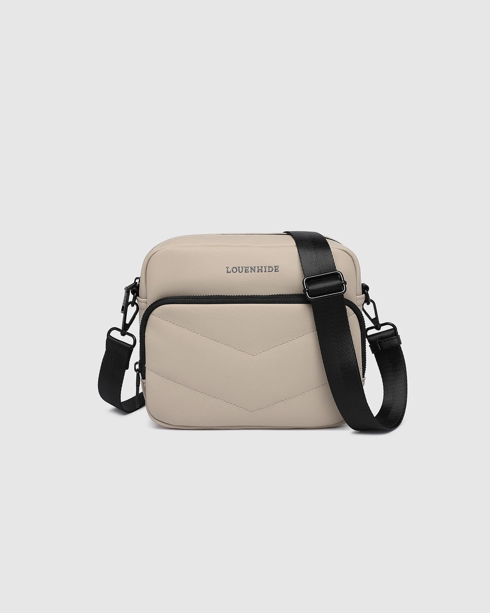 The Louenhide London Crossbody Bag strikes the perfect balance between simplicity and style. While the classic, compact, camera-bag shape is perfect for storing more than the everyday essentials, the multi-compartment design keeps everything you need within reach. From your phone, wallet and keys to your digital camera, a small water bottle and more - when life is on-the-go, take a bag that’s built for movement. Featuring an adjustable webbing strap to ensure comfort, this women’s crossbody bag is the