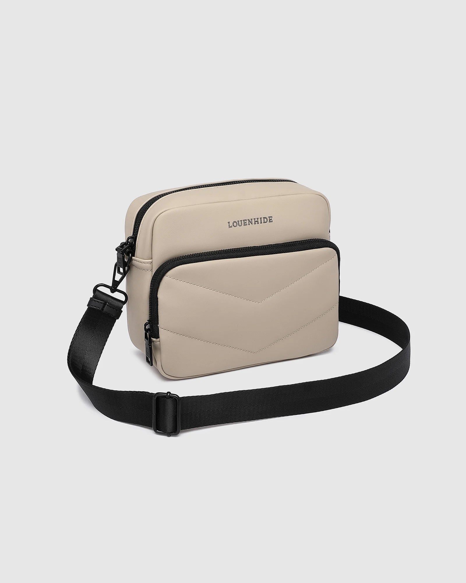 The Louenhide London Crossbody Bag strikes the perfect balance between simplicity and style. While the classic, compact, camera-bag shape is perfect for storing more than the everyday essentials, the multi-compartment design keeps everything you need within reach. From your phone, wallet and keys to your digital camera, a small water bottle and more - when life is on-the-go, take a bag that’s built for movement. Featuring an adjustable webbing strap to ensure comfort, this women’s crossbody bag is the